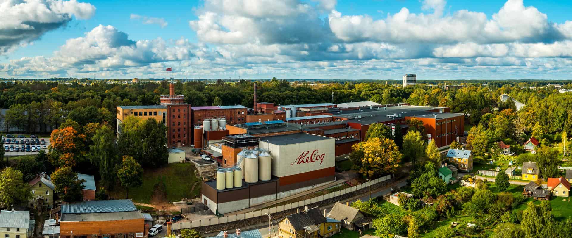 The image displays the A. Le Coq brewery and Beer Museum located in Tartu, Estonia