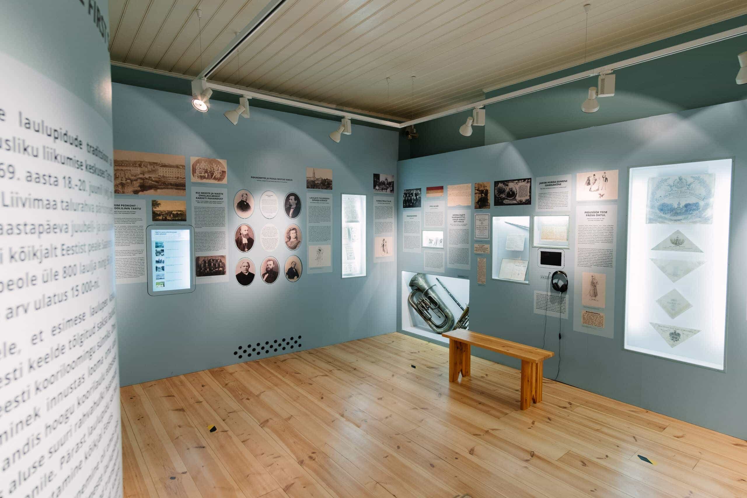 The image displays the Song Celebration Museum (Laulupeomuuseum) in Tartu, Estonia