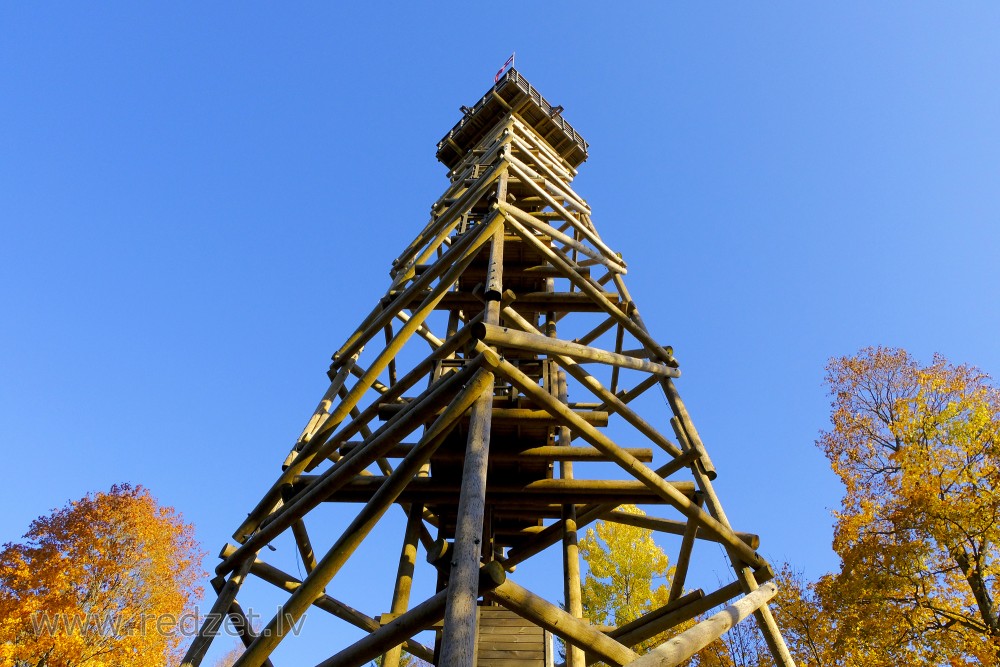 The image shows the Alūksne Observation Tower located on Temple Hill in Alūksne, Latvia