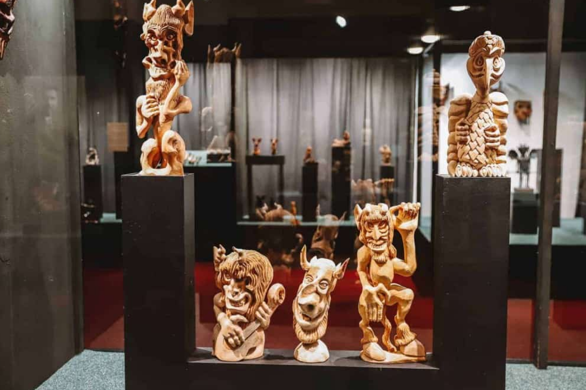 Wooden devil sculptures