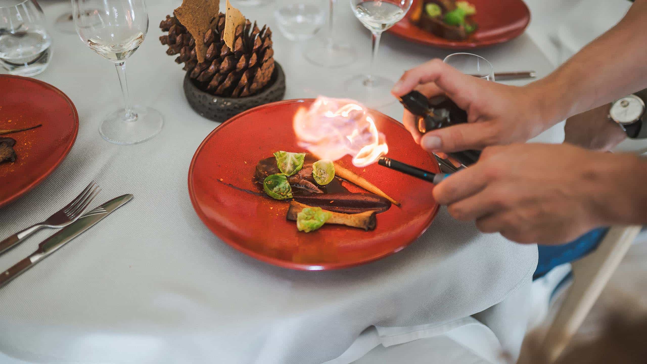 image depicts a fine dining experience at the Amandus restaurant in Vilnius