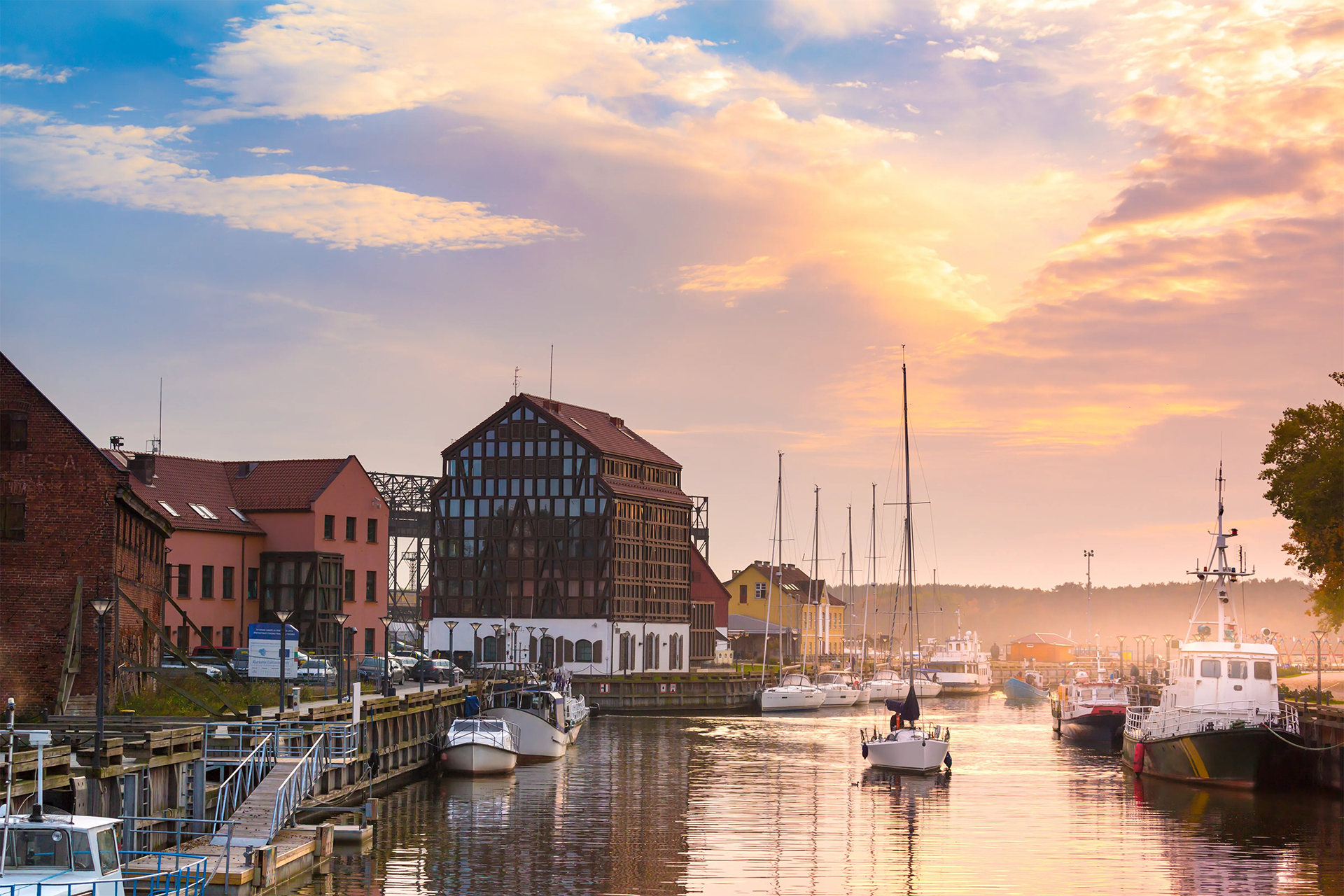 Lithuania harbor with boats at sunset