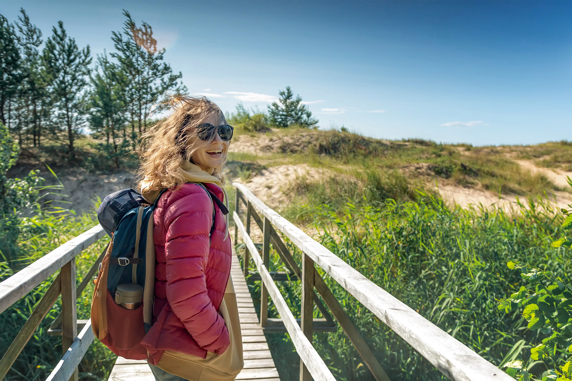Girl walking along a Baltic coastal trail