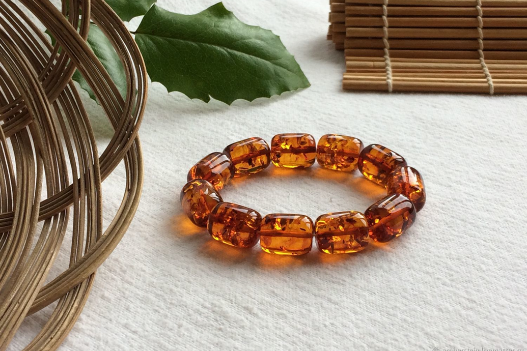 Handmade Baltic amber bracelet with polished golden-brown beads.