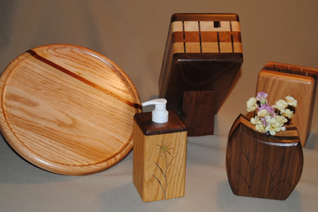 Handcrafted wooden kitchenware and decorative items displayed together.