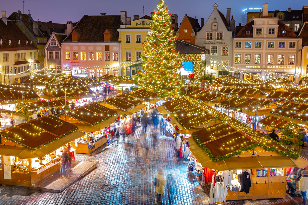 Tallinn Christmas Market glowing with festive lights and a decorated tree.